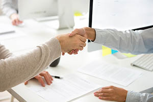 Business handshake over a contract